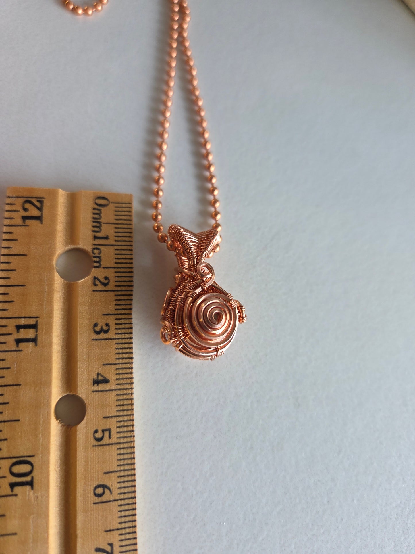 Copper Spiral Amulet Pendant
🌀🧡